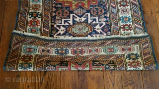 Antique Kuba carpet. Lesghi star design.
The half star is original.  The rug was not cut and spliced.
Uniform medium pile.  Professional repair of pucker in border. 
36 inches wide by 76  ...