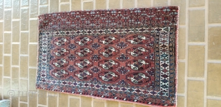 Turkmen Chuval.
Complete with back and remnants of ties.
Yomud??
Good pile on front and the piled band on the back.
Minor wear on red back.
47 inches long by 27 inches wide.
     