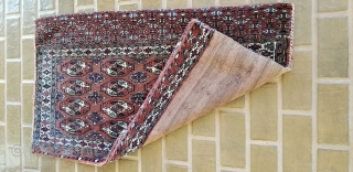 Turkmen Chuval.
Complete with back and remnants of ties.
Yomud??
Good pile on front and the piled band on the back.
Minor wear on red back.
47 inches long by 27 inches wide.
     