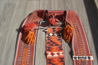 Camel Trappings.
Saudi Arabia, Al Hasa, Hofuf.
Both in excellent condition.
Large band is 100 inches long by 7 inches wide with leather wrapped wood end pieces.
Smaller band with elaborate tassels  is plain flat  ...