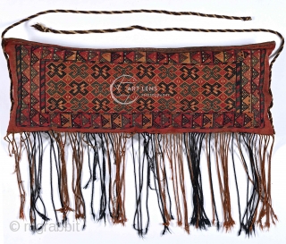 Yomut (?) sumakh torba, mid 19th century. All original and complete with its back, fringes, hanging ropes. Fantastic, early, mellow colours, incl. deep mauve madder, dark indigo, flashing greens, soft peach. With  ...