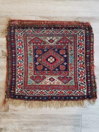Interesting Kurdish bag from north west Persia. Note the flatweave back is not connected at the sides and there is a little damage to one corner.
52 x 54 cm    