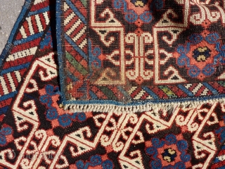 Lovely and unusual antique Kuba(?)Caucasian small poshti (?) rug, 95x62 cm.,ca. 1900, with multiple kufic border elements used as field design. Woven on woolen warps with brown woolen wefts. It has a  ...