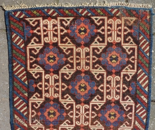 Lovely and unusual antique Kuba(?)Caucasian small poshti (?) rug, 95x62 cm.,ca. 1900, with multiple kufic border elements used as field design. Woven on woolen warps with brown woolen wefts. It has a  ...