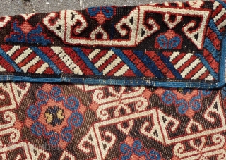 Lovely and unusual antique Kuba(?)Caucasian small poshti (?) rug, 95x62 cm.,ca. 1900, with multiple kufic border elements used as field design. Woven on woolen warps with brown woolen wefts. It has a  ...