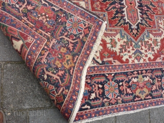 Heriz 378 x 299 cm., 12'5" x 9'9" , with some wear around the center. Heavy and tightly knotted piece, 52 kgs.           