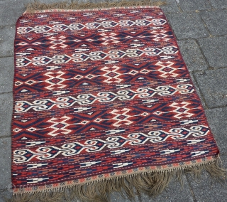 Antique Yomud Kilim, 134 c 123 cm., 4' 4" x 4'. Natural dyes and a hot red, but without colour transfer. Good condition, except for a finger tip seize hole ( see  ...