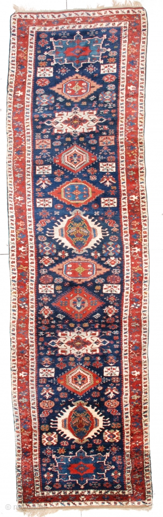 Karadan (Kazak)#6453 runner 3’8″ x 13’6″ #6453 This circa 1850 antique Karadan Kazak Oriental rug runner measures 3’8” x 13’6”. It has eleven different shaped, sized and colored medallions on a dark  ...