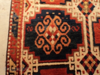 This circa 1875 Caucasian Kazak rug #7283 measures 3’9” X 6’6”. It has the Mogan motif in red and blue with ivory negative spaces. It has one narrow border with the lazy  ...