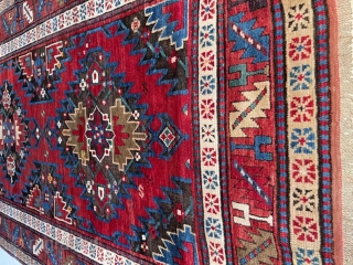 This circa 1875 Gallery sized Kazak #8105 measures 4’7” X 10’4”. It has a very strange and complicated design. There are three medallions on a black ground. The medallions contain three different  ...