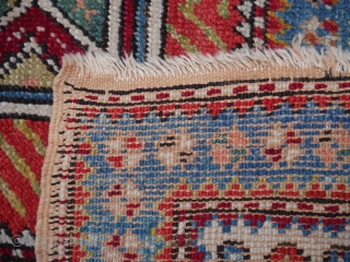 A Sufi meditation/prayer rug , 4.3 x 3ft. (131 x 91 cm.) around 1900. SW Anatolia. The red ground depicts one central column of wisdom, containing the five aspects of Islam: faith,  ...