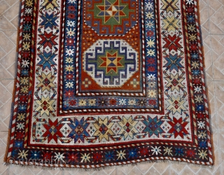 An antique Genje long rug with Memling (Moghan) Guls. 120 x 296 cm. late 19 th. century.  This design with hooked octagons is a very old design, dating back to the  ...