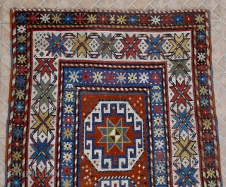 An antique Genje long rug with Memling (Moghan) Guls. 120 x 296 cm. late 19 th. century.  This design with hooked octagons is a very old design, dating back to the  ...