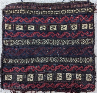 A fine Baluch chanteh, with mixed technique (piled knotting and various flatweave techniques). Silk highlights. Very uncommon. Good condition. Size: 13" x 13".          