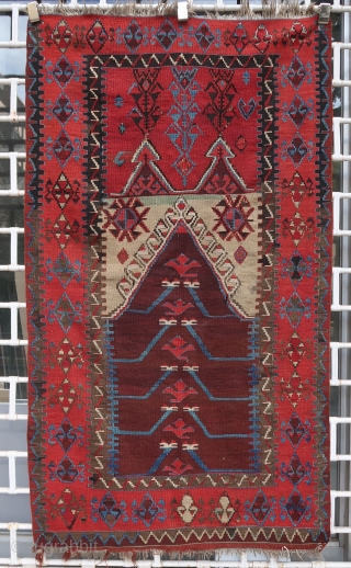 Old and beautiful Konya area "Tulip" kilim (179 cm x 102 cm). Very good dyes, with an especially shimmering red. Good condition for its age, 2 small repairs in the upper corners.  ...