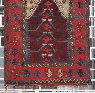 Old and beautiful Konya area "Tulip" kilim (179 cm x 102 cm). Very good dyes, with an especially shimmering red. Good condition for its age, 2 small repairs in the upper corners.  ...
