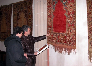 Stefano and Vincenzo, an expert on colour retouching, checking colors against the original rugs for the publication Stefano and Vincenzo, an expert on colour retouching, checking colors against th