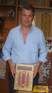 Stefano Ionescu with his bench-mark publication on Anatolian rugs in Transylvania Stefano Ionescu with his bench-mark publication on Anatolian rugs in Transylvani