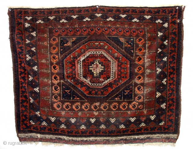 Rather huge Baluch bagface with a particularly bold rendering of a Salor Gul. Natural dye purists need not apply as there are three rows of botehs and some highlights rendered in some  ...