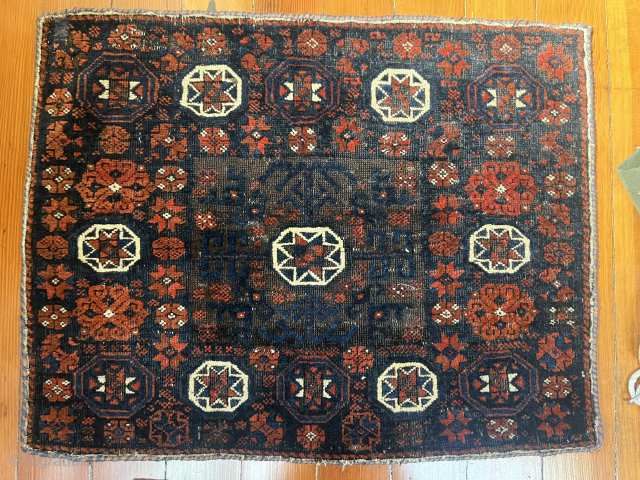 Baluch bagface, around 1880. Dark browns are uniformly etched which creates a nice sculpted effect. Colors quite vivid, in particular the unusually intense red, pile lustrous. 26" x 20" (66cm x 51cm), ...