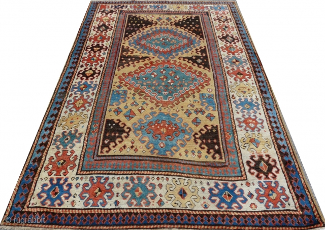 Rare Borjalou Kazak rug, 196cm x 135cm (6'5" x 4'4", circa 1875. An exceptional example. Typical use of repeating hooked lozenges, but filled with very unusual scattered kites! Lovely palette with a  ...