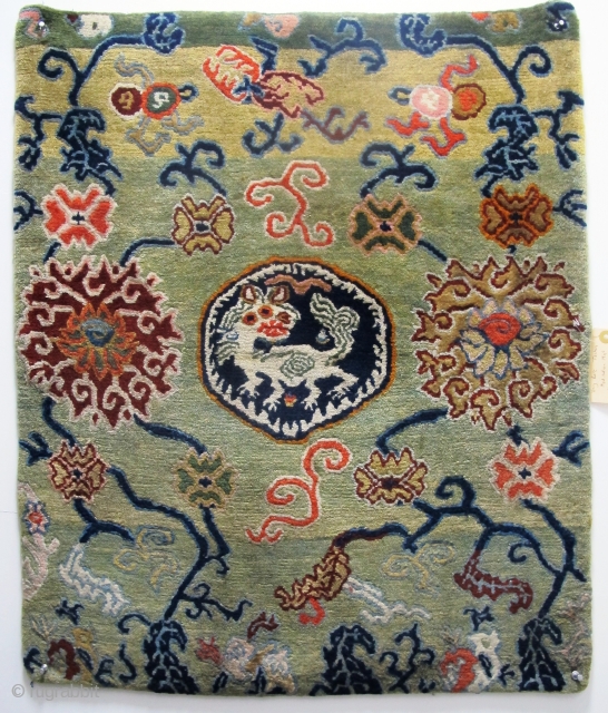 Rare Tibetan Meditation Mat, 78cm x 65cm ( 2'8" x 2'2"). Last quarter of 19th century. Beautiful abrashed field with a Tibetan dragon, the symbol of communication and enlightenment. Great wool quality  ...