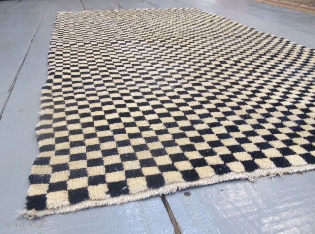 Tibetan Checkerboard Rug, 1.62m x 0.93m (5'3" x 3'1")
Alternate squares of dark blue and undyed ivory wool. Subtlety and texture are provided by the abrash and the slight variation in each of  ...