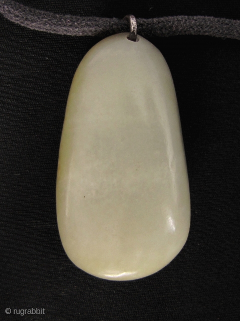 Hetian Jade Pebble Pendant 和田玉: Subtle nephrite “pebble” jade stone with original russet skin highlights, from Xinjiang. It has been polished on one side to achieve symmetry but other then that this  ...