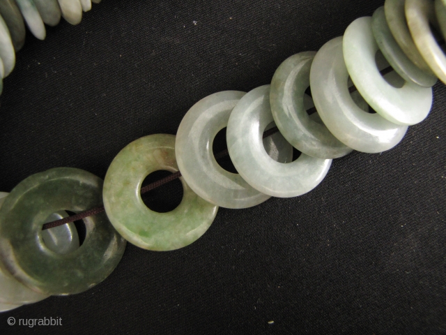 100 Jade Bi: One hundred antique perforated untreated Jadeite discs, circa 1880 to 1950. These were acquired from a Hong Kong jade dealer going out of business due to the ever increasing  ...