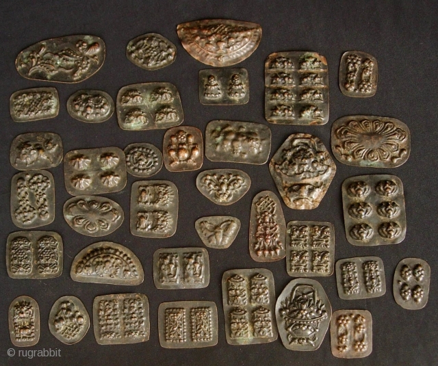 Buddhist Charms: Quirky and eclectic collection of 35 small repousse auspicious good luck tokens. These were collected in Dali, Yunnan, China in the late 1980s. No two are exactly alike and they  ...