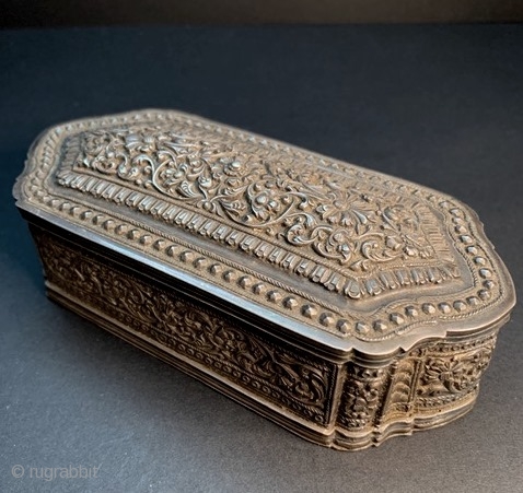 
Fine and elegant 19th century Sri Lanka repoussé and chased silver box. Excellent condition, except a few tiny dents on the bottom edges.  L: 14.2cm/5.6in x W: 4.2cm/1.6in x H: 6.2cm/2.4in.

http://www.abhayaasianantiques.com/items/1449233/Sri-Lanka-Silver-Trinket-Box

 