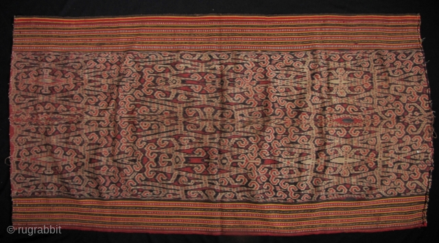 Lovely Iban woman’s skirt from the Kapit region in Sarawak, circa 1940-1950. The broad center field is woven from handspun cotton and natural dyes. The red use in this is particularly rich.  ...