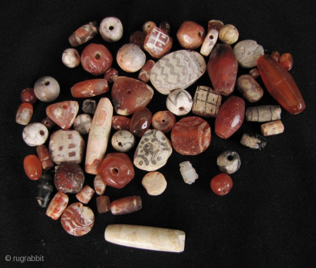 Etched Carnelian Beads: Loose strand lot of mixed etched and faceted beads from what is now Pakistan. I bought these along with a group of Bactrian and Kushan coins so these come  ...