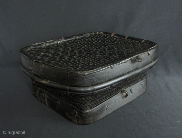 Lombok Basket

Well made old storage basket, circa 1950s, acquired in Lombok, Nusa Tenggara, Indonesia in the 1980s this has been in storage since then. This has a slight trapezoidal shape to the  ...