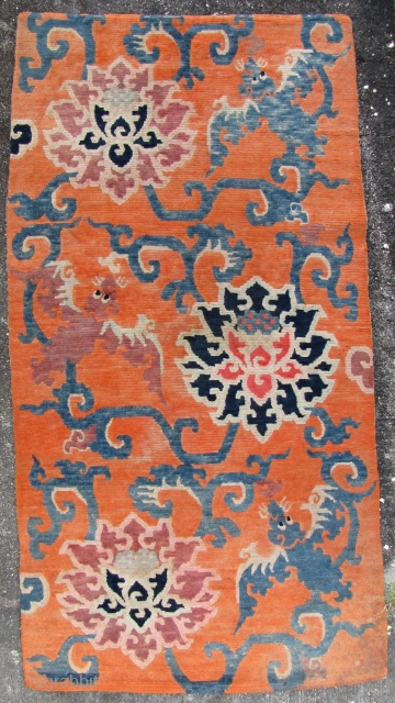 Tibet Carpet with Auspicious Symbols: Charming old khaden carpet circa first half 20th century.  W: 87cm/24in x L: 167cm/66in from Tibet with wool weft and pile and cotton weft.  This  ...