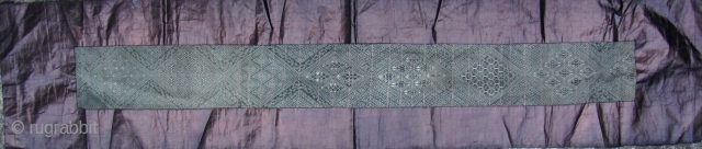 Fine and rare early 20th century Miao baby carrying strap from Zhouxi, Guizhou China. Please note that every diamond shaped medallion pattern is different. This is woven from all handspun silk warp  ...
