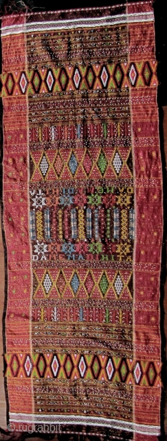 Colorful hand woven beaded shoulder cloth from the Batak people, Sumatra. This piece is quiet lively and complicated with gold treads, and large “Rasta” colored diamond patterned warp embroidered bands. The “Dame  ...