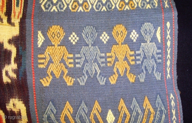 A beautiful example of Sumba Hinggi with 2 techniques, Ikat and traditional.   Mystical figures 4 bold human figures with mysterious designs on their chests and body, two on each woven  ...