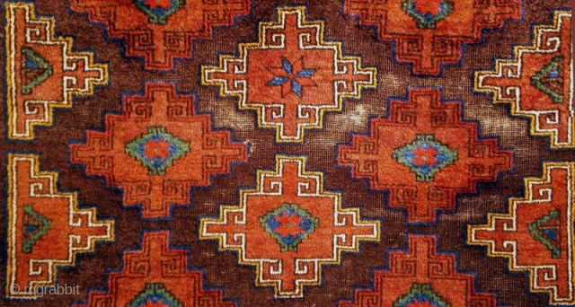 Baluch with traces of the original brocaded kilim ends; wool is soft lustrous and very silky. The ground aubergine-brown is corroded giving to the pattern a nice relief effect.Late 19th or early  ...