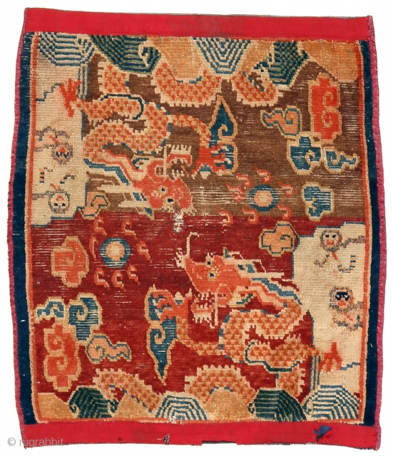 http://rugrabbit.com/content/hunting-and-gathering-china-tibet-and-east-turkestan     

Part of our online exhibition, "Hunting and Gathering: China, Tibet, and East Turkestan" 

Small rug with dragons
Tibet
Circa 1900
76 x 63 cm (30 x 25 in.) 

Knot count:	11  ...