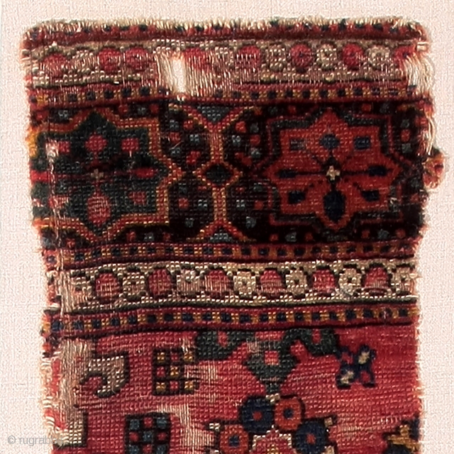 Detail of an early rug fragment from the Golden Triangle                       