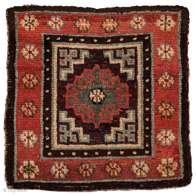 Meditation mat with archaic Mandala, Tibet, circa 1850, 62 x 61 cm (24.5 x 24 inches)
Tibetan rugs with thick squarish knots and a brilliant palette are considered among the earliest, often referred  ...