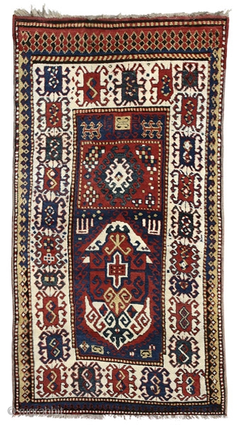 Borchalo Kazak prayer rug
Southwest Caucasus
circa 1870
220 x 117 cm (7’3” x 3’10”) 
Alg 1528
symmetrically knotted wool pile on a wool foundation
A rare and unusual rug characterised by a two panel design: the  ...