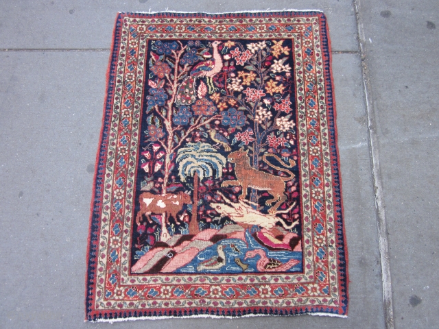 Antique Tabriz Pictorial Mat circa 1920's , 3 x 2.3
A very amusing and informal small rug from Tabriz.The navy field of this "pushti"has a whole jungle packed into a small format.It comes  ...