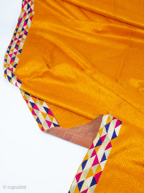 Golden Orange Phulkari Vari Da Bagh


Western Punjab, early 20th century, circa 1930. 242.5 x 127.5cm (95.5 x 50 inches). This beautiful, deep golden orange phulkari is densely embroidered in floss silk on  ...