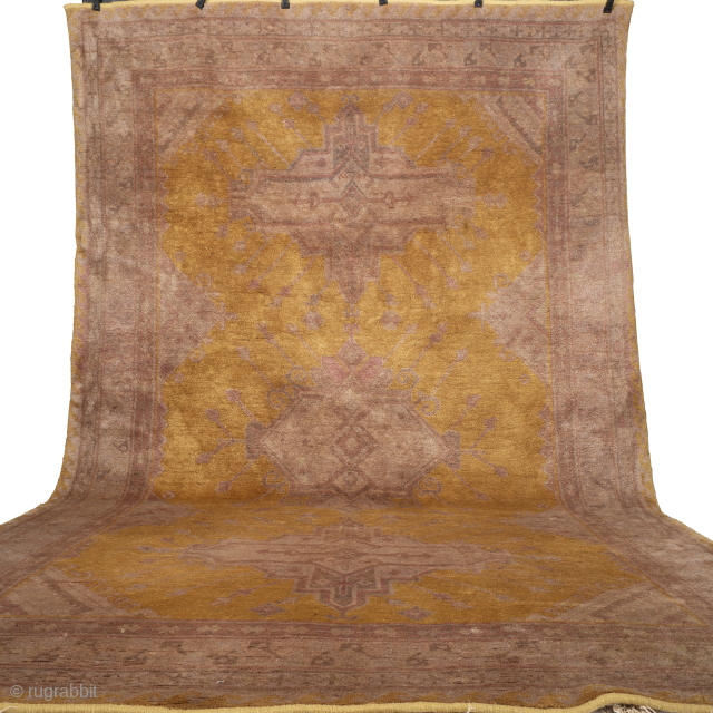 Gold And Fawn Antique Khotan Rug
A superb example of an antique Khotan rug in wonderful condition. Exceptionally soft and lustrous wool quality, with a highly unusual design and colour palette. The quality ...