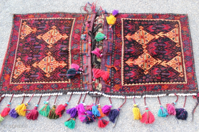 Rare Persian Afshari saddlebag, with original tassels and extra ordinary design, well executed art work, goat hair closure loops & hangers in both sides are all intact, Collectors item.
CATEGORY: Persian
ORIGIN/TYPE: Afshari /  ...