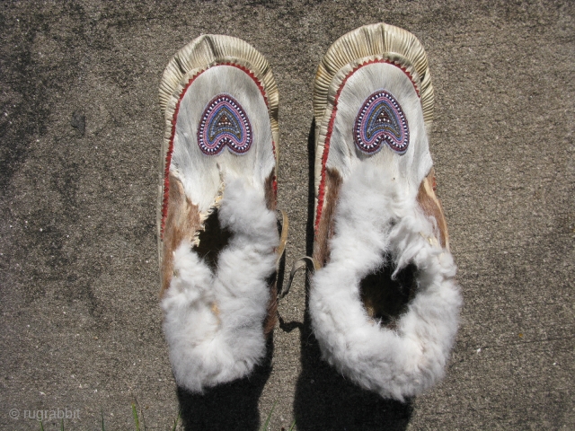 Antique Inupiat moccasins, also Inupiaq, a people of Northern Alaska, part of the Inuit Peoples, hand sewn with beaded hearts, 1st QTR 20thC, used with signs of use and soiling, the approximate  ...