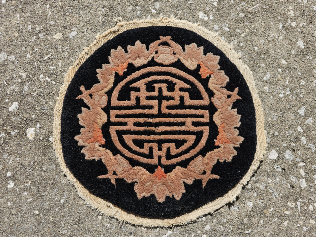 Small round Chinese rug from the Art Deco period, Fette-Lee type weave, black with Shou and bat design, the Shou symbol represents long life and monetary abundance, bats are a symble of ...