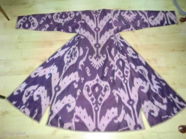 ikat coat. Some small tears in silk on outside and a couple of small stains (2nd photo) but still highly decorative and presentable. ask for more photos      